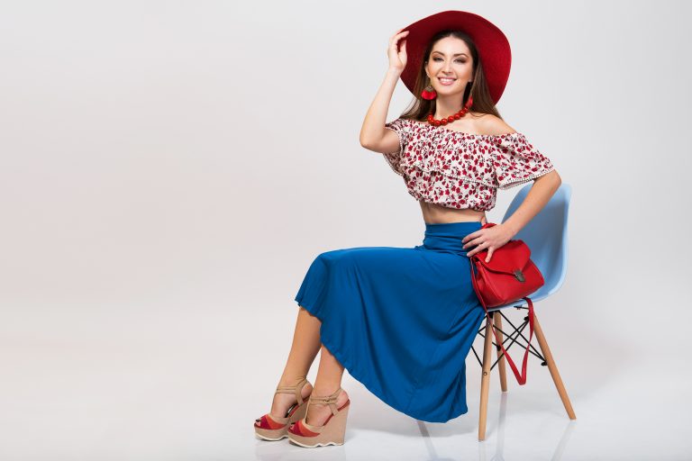 woman posing with stylish footwear summer fashion and bag